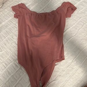 Pink body suit with criss cross back